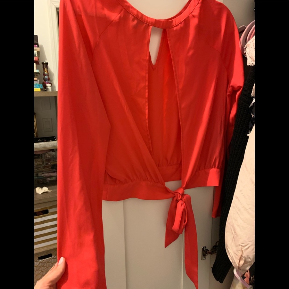 Express blouse with bell sleeves and cut out back